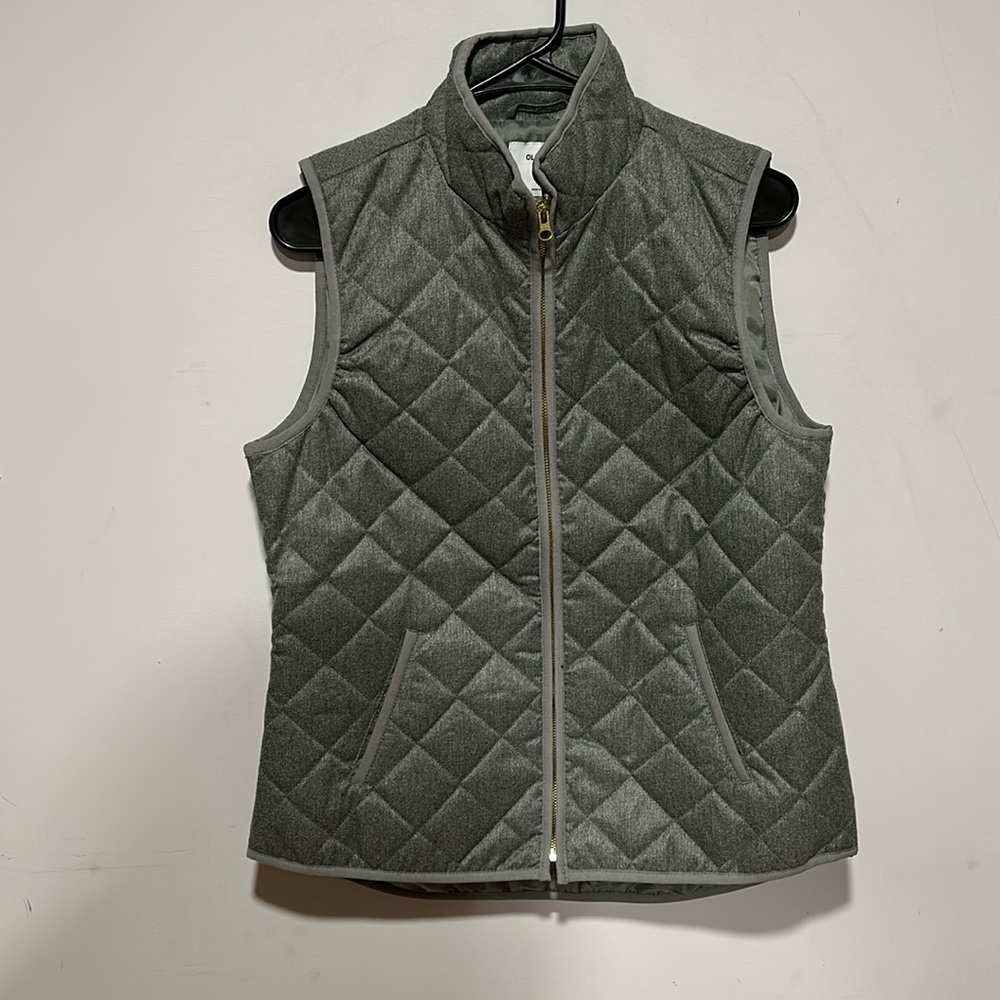 ON quilted vest.